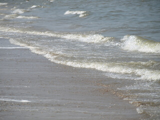 Calm waves at the beach of the north sea in Katwijk/NL