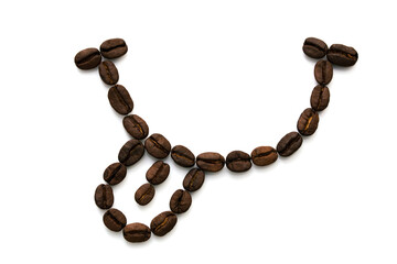 Image of a smile with a tongue made of many coffee beans