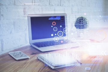 Fototapeta premium Double exposure of laptop computer and technology theme hologram. Concept of freelance work.