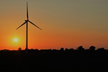 Wind turbine at sunset