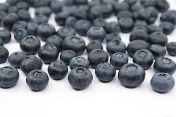 Blueberries isolated on a white background. Fresh blueberry wallpaper.