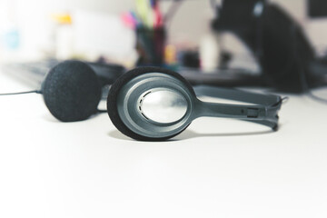 Obraz na płótnie Canvas Headphones on desk, work environment