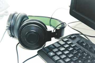 Obraz na płótnie Canvas Headphones on desk, work environment