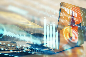 Computer on desktop in office with technology theme hologram. Multi exposure. Tech concept.