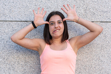 young millennials is portrayed with funny expressions, childish and stupid, portrait of a girl who...