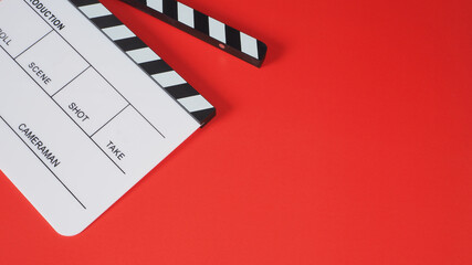 Clapperboard or movie slate on red background.it use in video production and film industry .