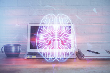 Multi exposure of work table with computer and brain hologram. Brainstorm concept.