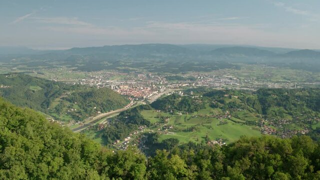 4K Drone Reveal Shot Of City Surrounded With Nature