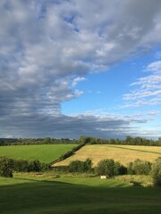 Summers day with freshly cut meadows and blue sky