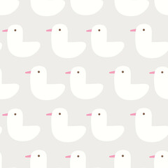 Seamless pattern design with cute white ducks on light grey background. Perfect for fabric, textile, kids fashion. Surface pattern design.