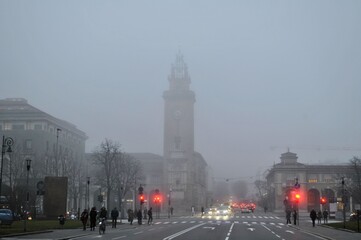 Bergamo old Italian town morning fog medieval buildings urban panorama beautiful cityscape red traffic lights
