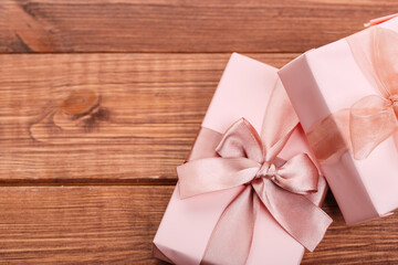 Beautiful gift box with altas bow on a vintage wooden board. holiday card concept.