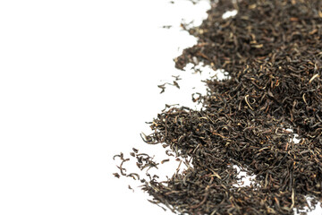 Leaves of black premium dry tea on a white background