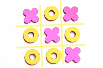 Illustration of kid tic-tac-toe wood board game. Yellow and pink figures on white background....