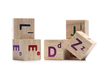 Educational wooden building blocks with letters isolated on white background