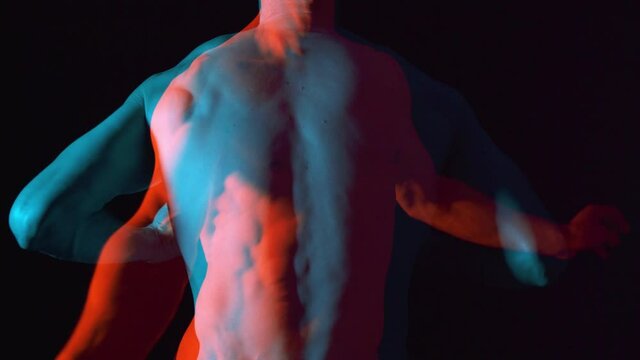 Overlaying of two male naked bodies. Strange surrealist conceptual body movements.