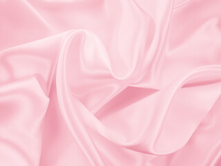 Beautiful elegant wavy light pink satin silk luxury cloth fabric texture, abstract background design. Copy space