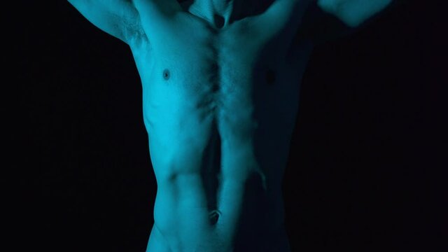 Naked body torso athlete with strong body. Dancer warming up muscles doing dance moves.