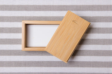 Naklejka na ściany i meble opened wooden box on stripe background with place for you logo . with copy space