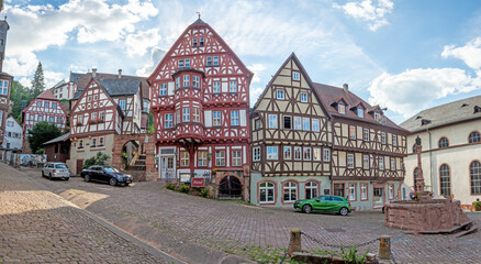 Fototapeta na wymiar Historic half-timber facade in the medieval German city of Miltenberg during daytime