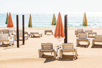 Empty deck chairs at beach during quarantine times