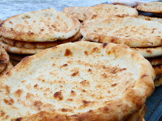 Naan in Turpan,?Xinjiang,?China, leavened and oven-baked?flatbread, it is merely the generic word for any kind of bread, ?It can be used to scoop other foods or served stuffed with a filling.