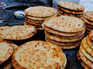 Naan in Turpan,?Xinjiang,?China, leavened and oven-baked?flatbread, it is merely the generic word for any kind of bread, ?It can be used to scoop other foods or served stuffed with a filling.