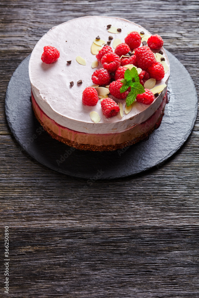 Wall mural raspberry mousse cake on a slate black plate