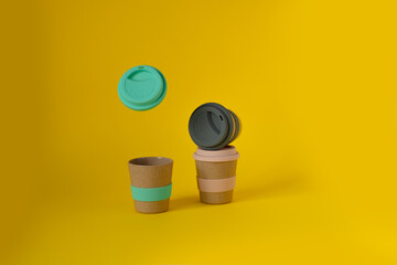  reusable coffee or tea cups mugs with multicolor silicone cap. zero waste .sustainable lifestyle.flat lay