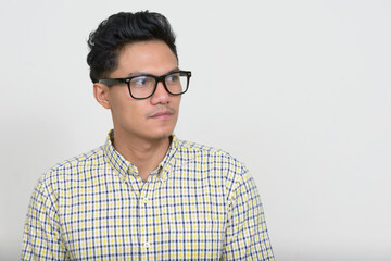 Portrait of handsome Asian hipster man with eyeglasses