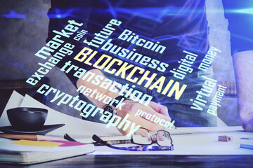 Man's hands working with notes background. Cryptocurrency and finance concept.