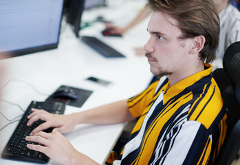 casual business man working on desktop computer