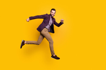 Fototapeta na wymiar Full size profile photo of handsome stylish well-dressed business guy jump high up rushing store mall sales season wear plaid shirt blazer trousers shoes isolated yellow color background