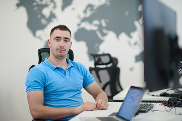 casual business man working on desktop computer