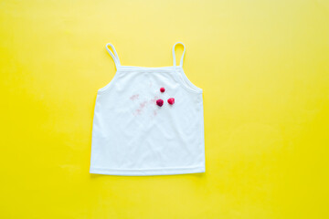 Casual t-shirt from raspberries on a yellow background