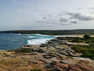 Beautiful view of a coastal walking trail along the ocean front with a view of Marley beach, Royal National Park, Sydney, New South Wales, Australia