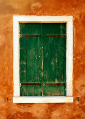 detail of a  old window with green shutters open 