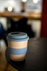 Cup of coffee on a table in a cafe. Sustainable lifestyle. Plastic free concept