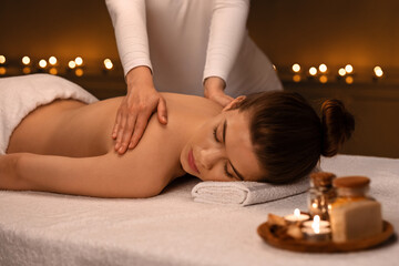 Woman having body massage session at newest spa