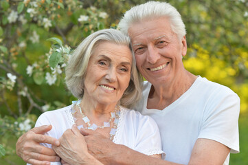 Portrait of beautiful senior couple posing in the park