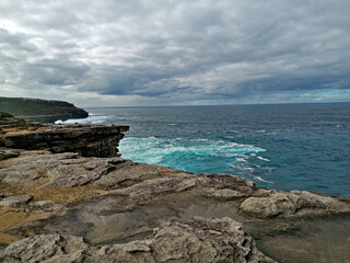 Beautiful and colorful rock formations along the sea cliff, Royal National Park, Sydney, New South Wales, Australia