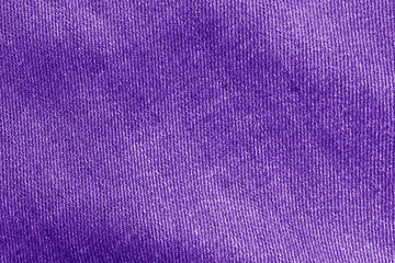 A close-up of purple fabric texture. purple fabric texture useful as a background