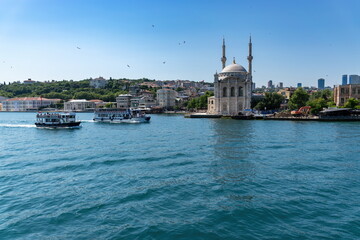 Fototapeta na wymiar Ferry tour on the sea front of historical mosque in istanbul