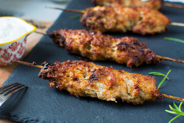 Homemade kebabs served with garlic sauce and rice.