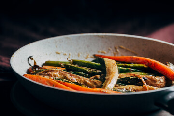 Vegetables sauteed in cream. sauteed in the pan, on the table ready to eat.