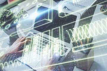 Science hologram with man working on computer on background. Concept of study. Double exposure.