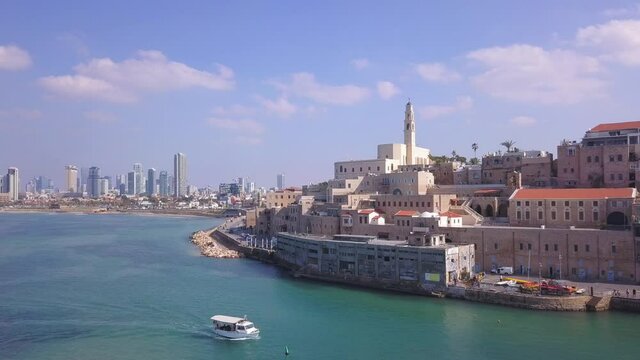 Tel Aviv and Jaffa skyline, aerial view above the old city and port of Jaffa and TLV coastline in the background.