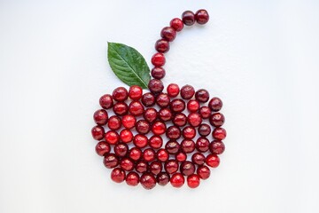 Red cherry ripe juicy on a white background.