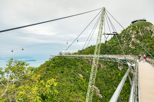 The sky bridge in the north of Langkawi, Malaysia. The landmark of the small Malaysian Island. One pillar and 12 cable holding the bridge over the valley. A  breathtaking view over the Andaman Sea 