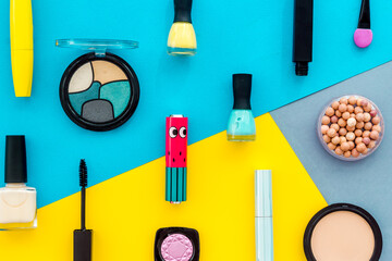 Flat lay of decorative cosmetics on color background. Above view